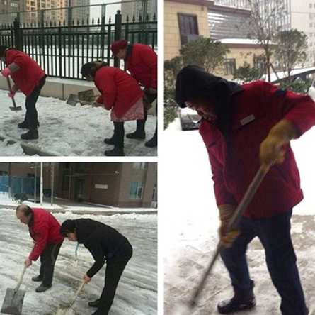 齐峰物业的师傅们清扫积雪中